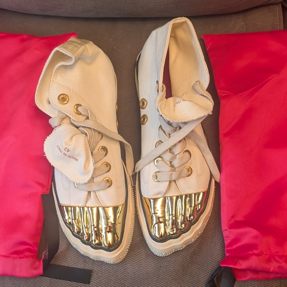 Gold toe, high top, canvas tennis shoes.